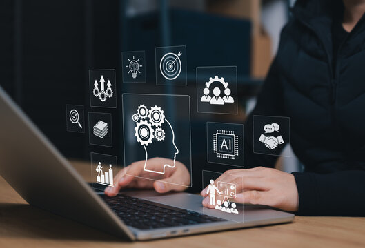 AI skills development and business training concept. Person using laptop with human intelligence, education, target goals, modern job skills, learning resources, innovation strategy, productivity
