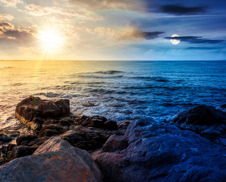 sea coast with stones and rocks. day meet night. summer vacation background at twilight. sun and moon in harmony over seascape with rough terrain. relaxing at the sea. coast of bulgaria wallpaper