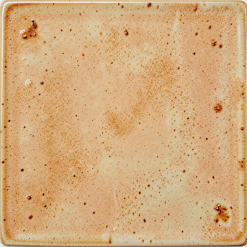 Ceramic texture with warm almond tones and speckled surface detail