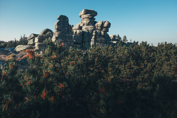  Massive granite rock formations on a mountain summit under blue sky © Jan