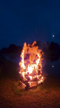 big midsummer bonfire burning at night