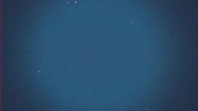 Vintage blue film grain texture overlay with dust and scratches.