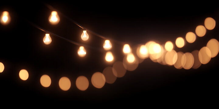 Light Bulbs Hanging in Dark with Soft Bokeh Effect. Glowing Christmas lights garland. 