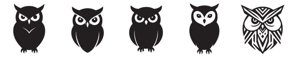 Obraz premium Set of owl head silhouettes vector