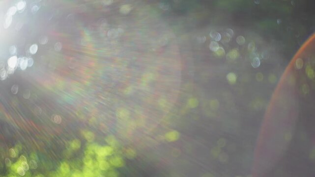 Bright camera lens flare background with sun rays and soft bokeh texture