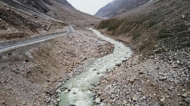 Scenic Aerial View of River flowing in Himalayan Mountains 