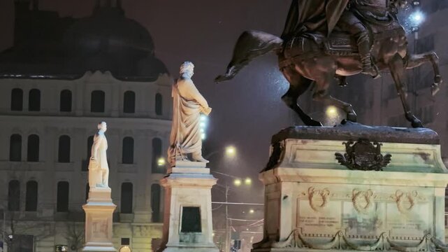 Snowfall on Bucharest University Square Monuments at Night
