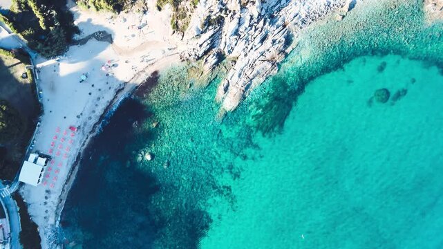 Rocks above the ocean, Italy. Elba Island in Tuscany, aerial view. Slow motion