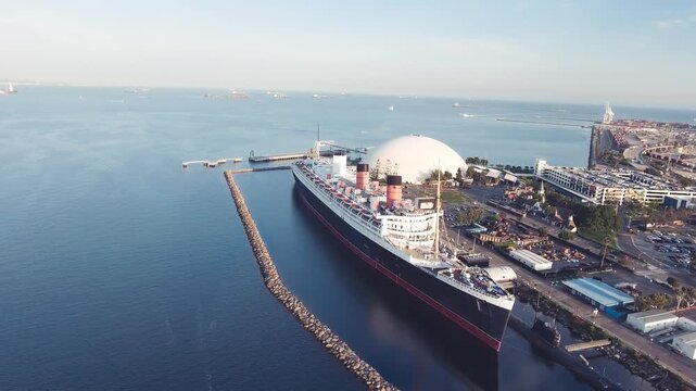 LONG BEACH, CA - August 2017: Historic Queen Mary in Long Beach, slow motion aerial view. This 1936 ocean liner and battlecruiser is now a hotel