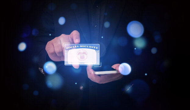 Person using smartphone with digital social security card hologram projection in dark background.