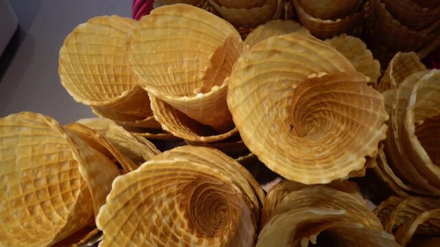 Karlskrona, Sweden A stack of freshly made ice cream waffle cones in an ice cream shop.