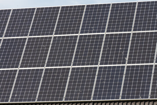 Breskens, Netherlands. Close-up of solar panels on rooftop highlighting renewable energy production and sustainability