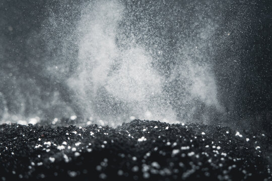 Dust rises from black soil during farm preparation in early morning light