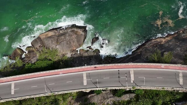 Top down drone view of coastal traffic above Atlantic shoreline Rio de Janeiro
