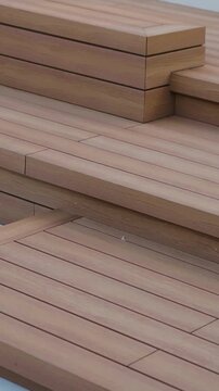 Vertical video. Wooden terrace with stairs near modern house and landscaped garden design.