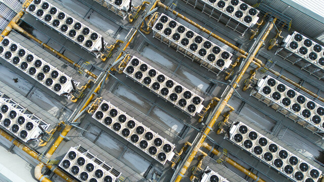Aerial view of the industrial cooling fans and ventilation systems on the roof of Rye House Power Station in Hoddesdon, England, United Kingdom.