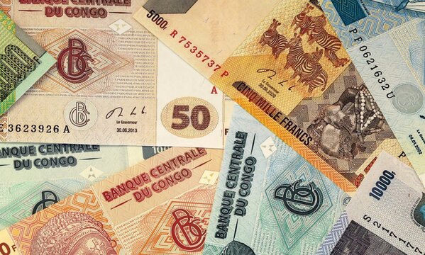 Congolese franc money bills in pile on table. Republic of the Congo XAF currency cash close up