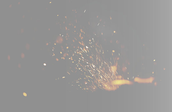 Abstract fiery sparks and embers overlay, twin glowing campfire particles on grey background wide banner. Symmetrical double fire blast sparks texture