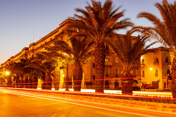 Naklejka premium Historical old town and harbor in the capital city of Valletta Malta at night