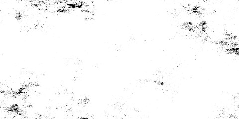 Fototapeta premium A minimal abstract scene of scattered black ink splatters and dust particles drifting across a clean white background. dirty grain and noise texture.