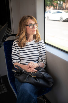 Portrait of mature woman on tram