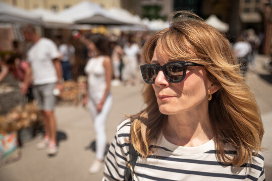 Portrait of stylish mature woman at outdoor market