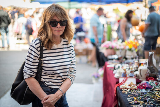 Portrait of stylish mature woman at outdoor market