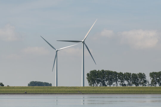 Breskens, Netherlands. Onshore wind turbines along the Westerschelde coastline representing renewable energy and energy transition