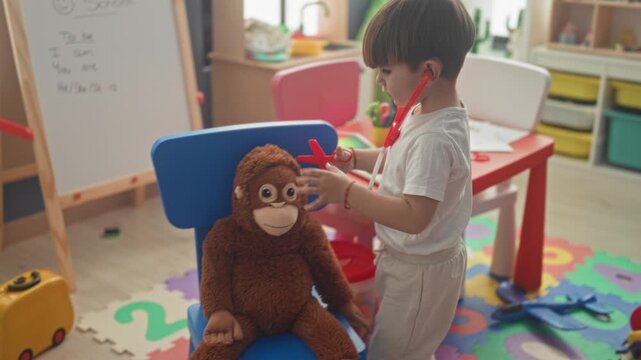 Boy plays doctor holding a red toy stethoscope to a plush monkey on a chair in a colorful playroom studio; playful nurturing.