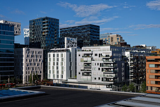 Oslo's Bj&oslash;rvika Waterfront: Modern Architecture, Clarion Hotel, and Urban Development Under Blue Skies.