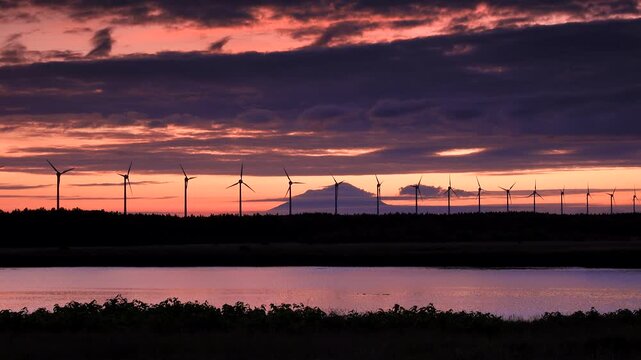 利尻島と天塩川と風力発電の夕景
