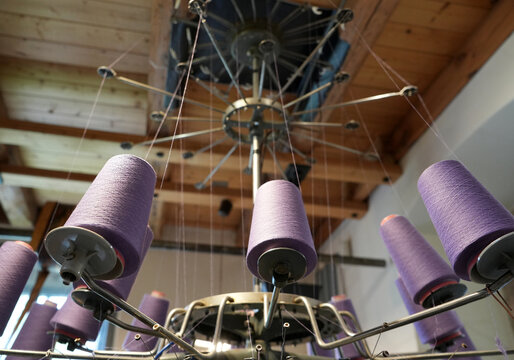 View of the spindles of a historic textile machine