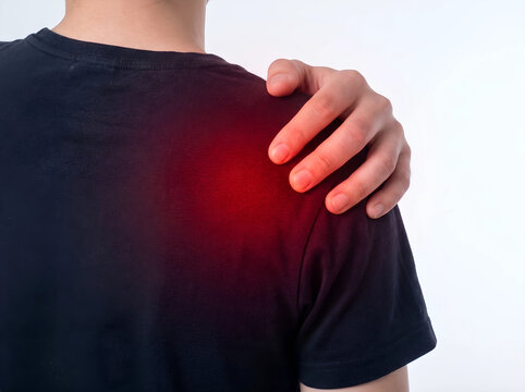 Person massaging shoulder in pain with red highlighted injury, shoulder