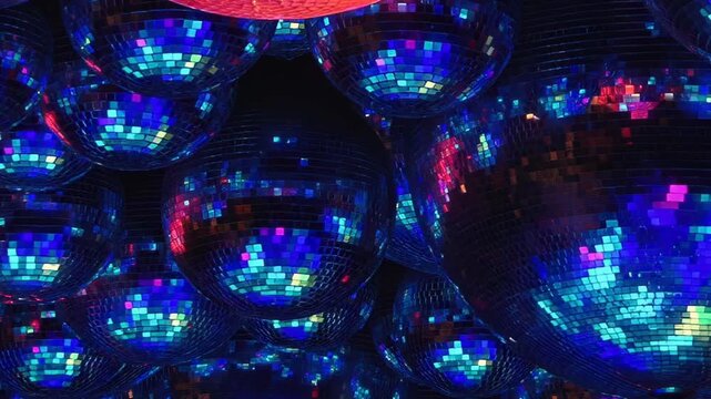 Numerous reflective spheres shimmer with evolving palette of radiant hues. From fiery red to cool blue, then verdant green and rich purple, luminous dance creates captivating spectacle in night.