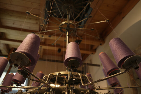 View of the spindles of a historic textile machine