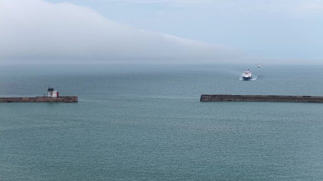 Ferry Approaching Dover Sea Walls Aerial 4K