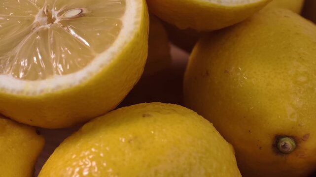 Close-up display of halved fresh yellow lemons