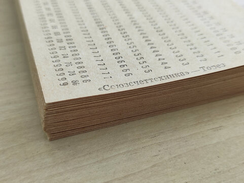 Vintage computer punch cards stack, retro data processing technology