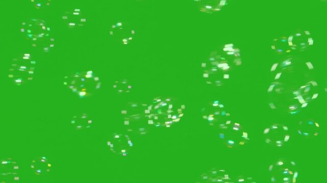 Soap Bubbles Floating in the Green Background. A large number of soap bubbles moving in one direction against a green background. Great for use in blending