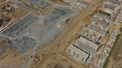 Fototapeta premium Industrial construction site with construction equipment and materials