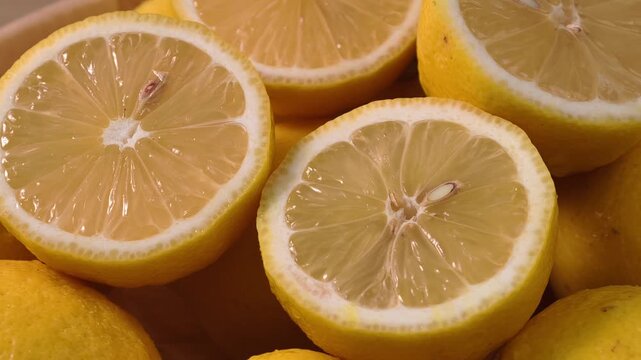 Close-up display of halved fresh yellow lemons