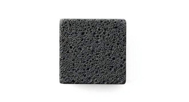 Square black volcanic pumice stone with highly porous pitted texture isolated on solid white background top-down view for spa skincare cleaning and natural material background