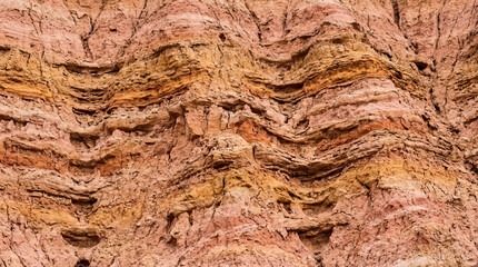 Fototapeta premium Detailed Macro Shot Highlighting Natural Intricate Erosion Patterns Across Sun Baked Desert Ravine Walls Landscape