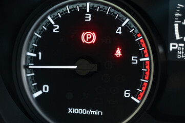 Fototapeta premium Warning lights on vehicle dashboard during driving session