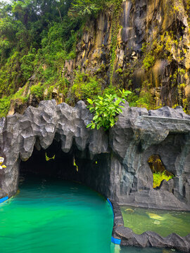 A tunnel entrance at a lazy river pool, designed for relaxing and floating along the water current on inner tubes
