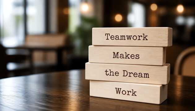 Wooden blocks with words 'Teamwork Makes the Dream Work'