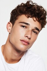 Naklejka premium Young male model with soft skin texture and natural look highlighting facial symmetry and clean grooming style