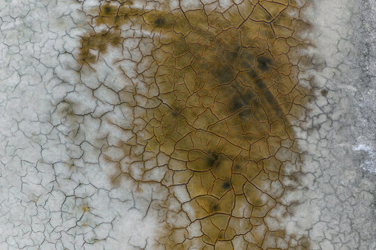 Aerial view of the cracked, dry earth patterns of the salt flats in La Ventana, Baja California Sur, Mexico.