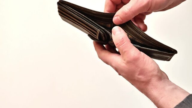 lack and shortage of money.empty wallet in the mans hands.Low salary. Lack of funds. Budget deficit and poverty concept. 4k footage
