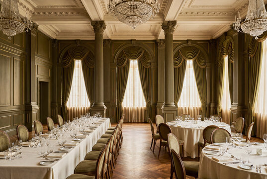 Luxury banquet hall with chandeliers and formal table settings